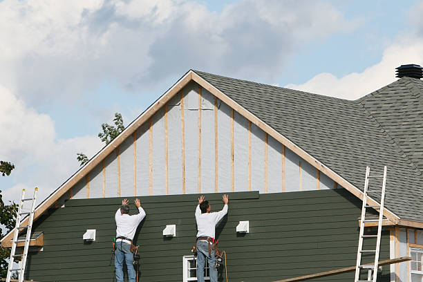 Professional Siding Contractor technician working in Webster, IN